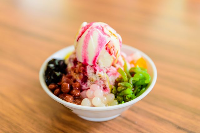Soft focus of Ais Kacang topped with basil seeds, peanuts, corn,