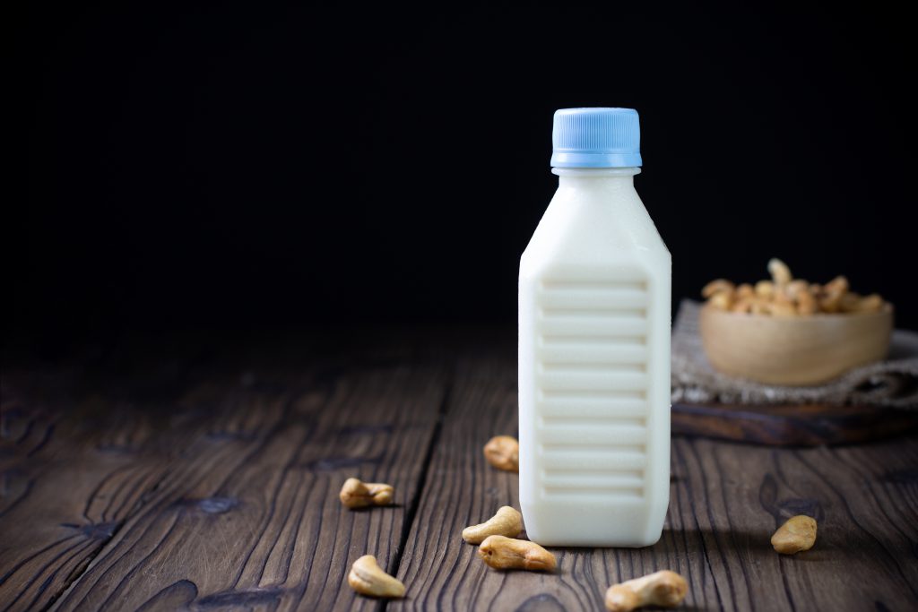 Cashew nut milk  in bottle on table